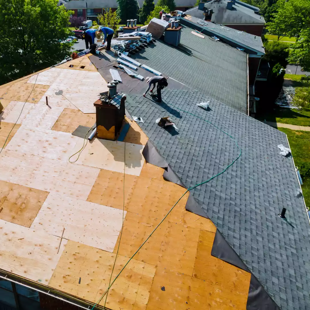 team replacing the roof of a home