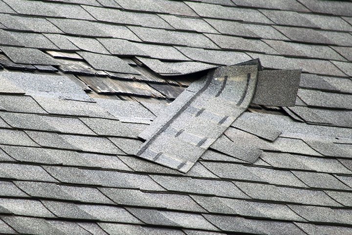 A photo of storm damage to a roof